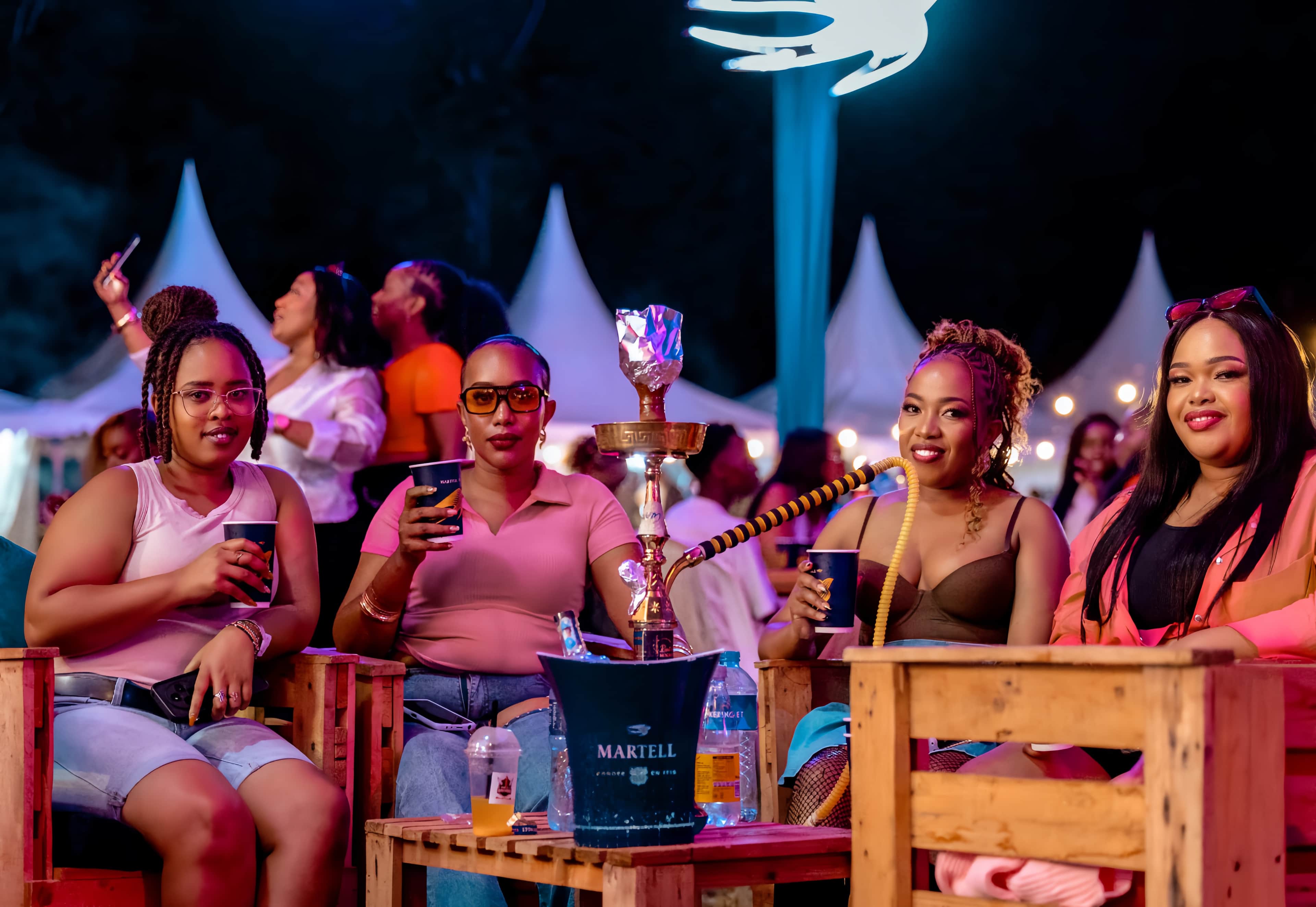 A crowd lit gold under the lights of an IncredibleNFriends night